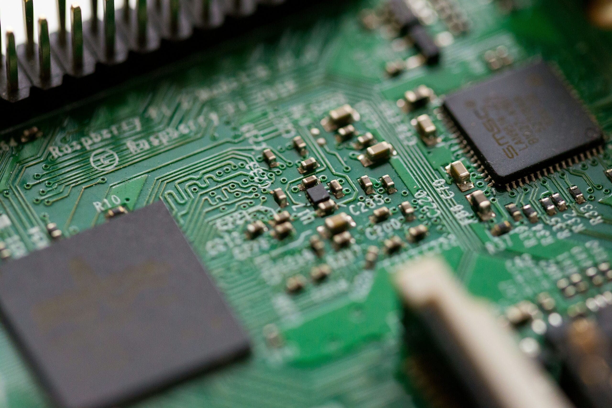 chris-ried-bN5XdU-bap4-unsplash a computer chip board close up